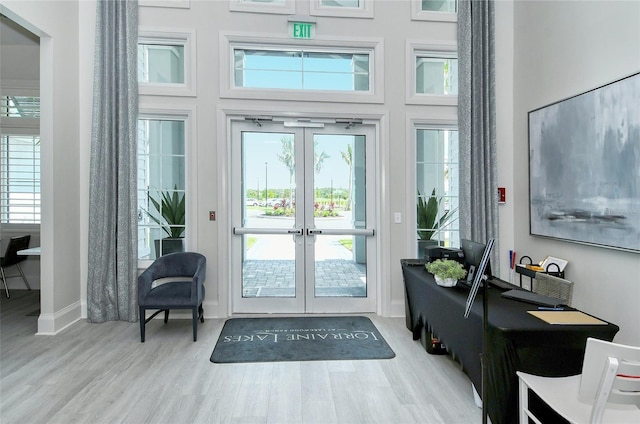 15160 Lyla Ter, Bradenton, FL 34211 - entryway with french doors, a towering ceiling, and wood finished floors