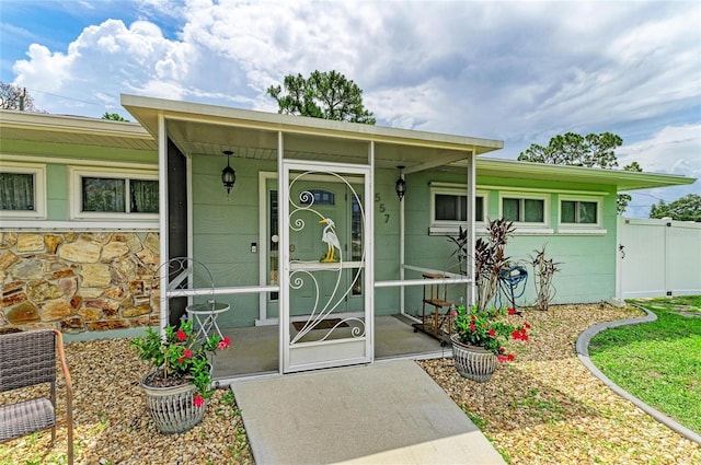 557 Reading St NW, Port Charlotte, FL 33952 - entrance to property featuring stone siding