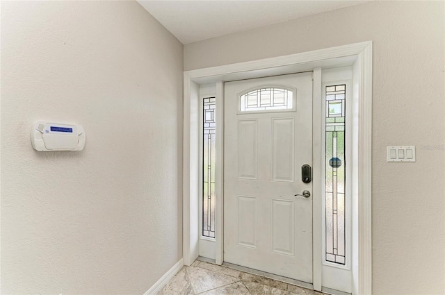 557 Reading St NW, Port Charlotte, FL 33952 - entrance foyer with baseboards