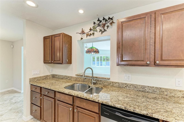 557 Reading St NW, Port Charlotte, FL 33952 - kitchen with stainless steel dishwasher, light stone countertops, and recessed lighting