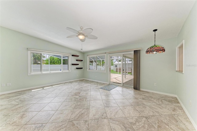557 Reading St NW, Port Charlotte, FL 33952 - spare room featuring a ceiling fan and vaulted ceiling