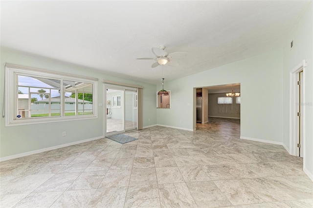557 Reading St NW, Port Charlotte, FL 33952 - unfurnished room featuring a chandelier, ceiling fan, and vaulted ceiling