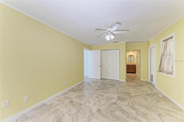 557 Reading St NW, Port Charlotte, FL 33952 - unfurnished bedroom with crown molding, multiple closets, and a ceiling fan