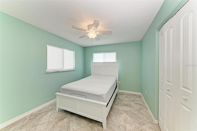 557 Reading St NW, Port Charlotte, FL 33952 - bedroom featuring baseboards and ceiling fan