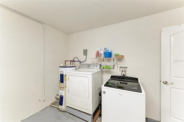 557 Reading St NW, Port Charlotte, FL 33952 - washroom featuring water heater and separate washer and dryer