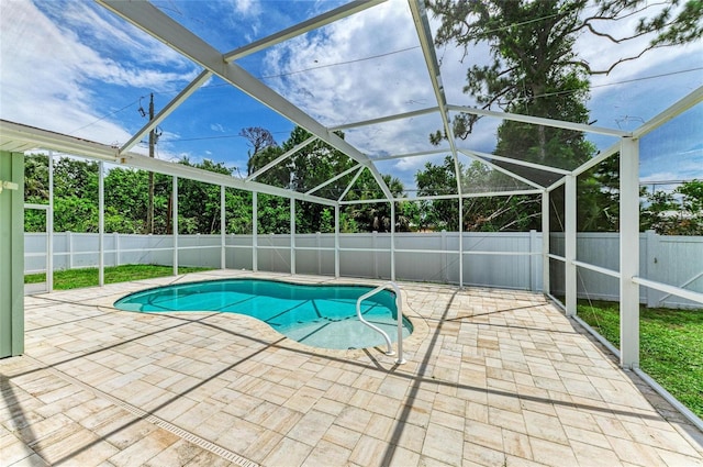 557 Reading St NW, Port Charlotte, FL 33952 - view of pool featuring a patio area, a fenced backyard, and a lanai