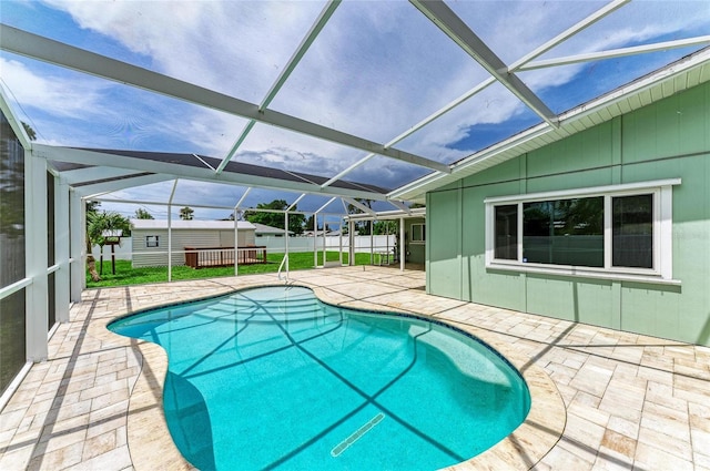 557 Reading St NW, Port Charlotte, FL 33952 - view of pool featuring a patio area, a lanai, and a storage unit