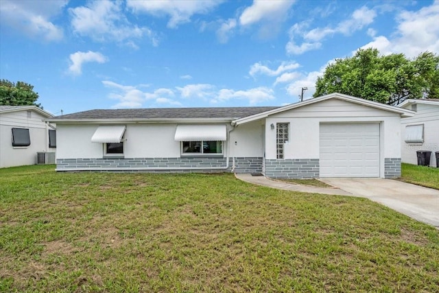 5401 Mac Arthur Ave, New Port Richey, FL 34652 - ranch-style home with concrete driveway, a garage, stucco siding, and a front yard