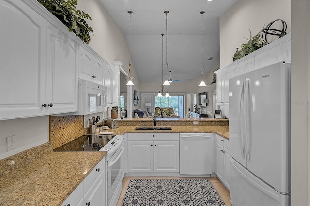 5240 Hyland Hills Ave Unit 1425, Sarasota, FL 34241 - kitchen featuring white appliances, high vaulted ceiling, white cabinetry, light stone counters, and a peninsula