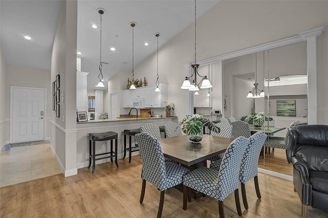 5240 Hyland Hills Ave Unit 1425, Sarasota, FL 34241 - dining area featuring high vaulted ceiling, light wood finished floors, and recessed lighting