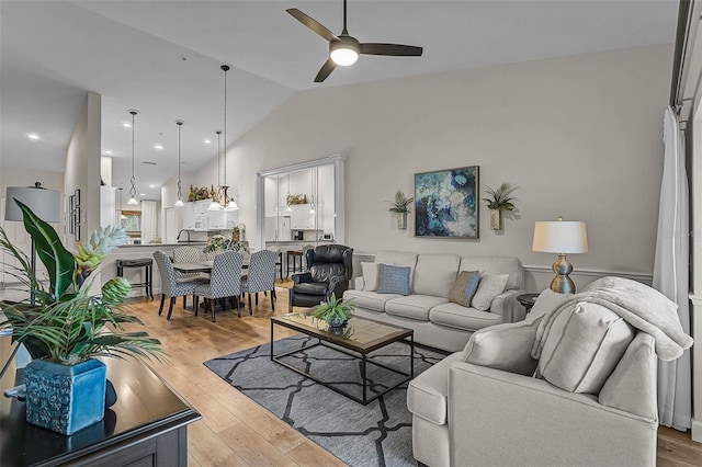 5240 Hyland Hills Ave Unit 1425, Sarasota, FL 34241 - living area with lofted ceiling, a ceiling fan, and light wood-style flooring