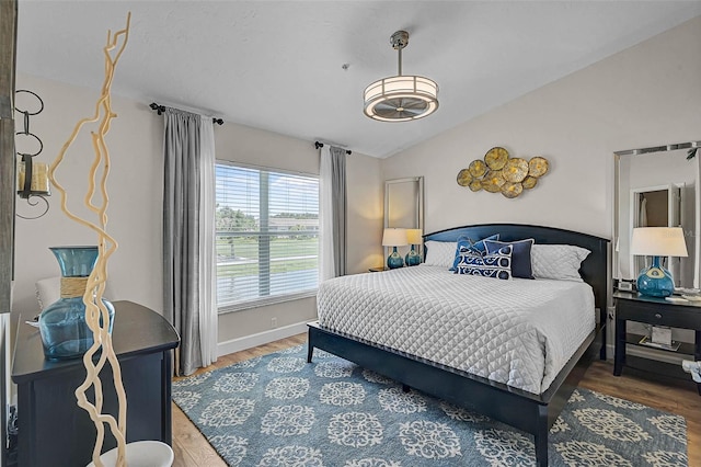 5240 Hyland Hills Ave Unit 1425, Sarasota, FL 34241 - bedroom with lofted ceiling and wood finished floors