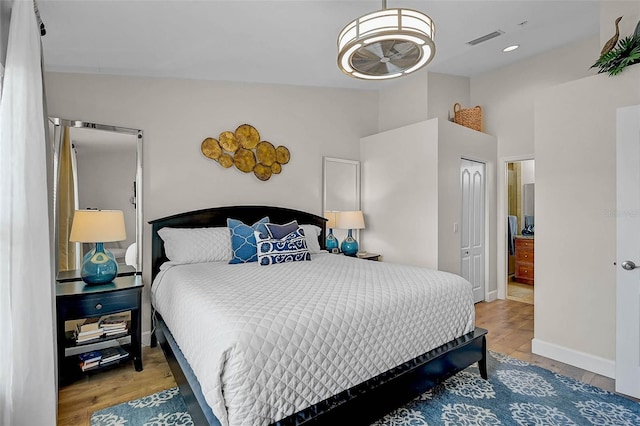 5240 Hyland Hills Ave Unit 1425, Sarasota, FL 34241 - bedroom featuring wood finished floors, a closet, and high vaulted ceiling