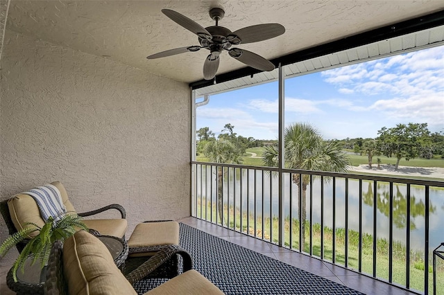 5240 Hyland Hills Ave Unit 1425, Sarasota, FL 34241 - balcony featuring a ceiling fan and a water view