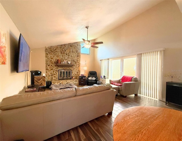 1502 Georgetowne Ln, Sarasota, FL 34232 - living area with ceiling fan, dark wood-style flooring, a stone fireplace, and high vaulted ceiling