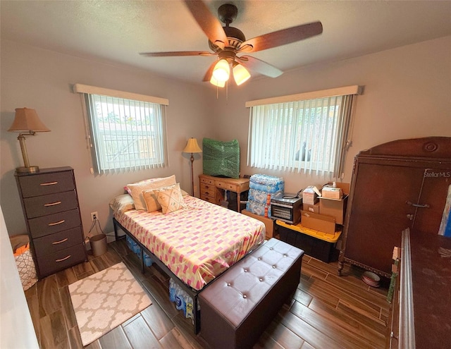 1502 Georgetowne Ln, Sarasota, FL 34232 - bedroom featuring wood finished floors and a ceiling fan