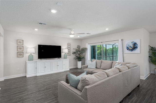 9144 Royal River Cir, Parrish, FL 34219 - living room featuring ceiling fan, a textured ceiling, dark wood-style flooring, and recessed lighting