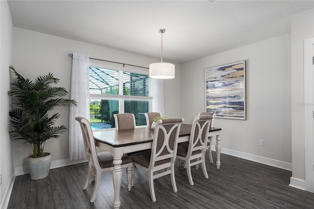 9144 Royal River Cir, Parrish, FL 34219 - dining room featuring dark wood finished floors and baseboards