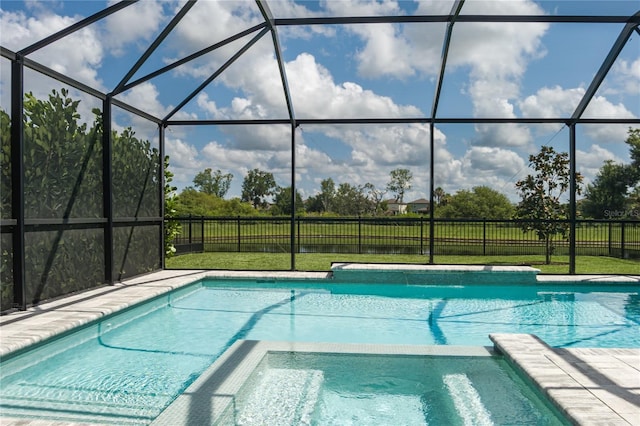 9144 Royal River Cir, Parrish, FL 34219 - view of pool featuring a pool with connected hot tub and glass enclosure