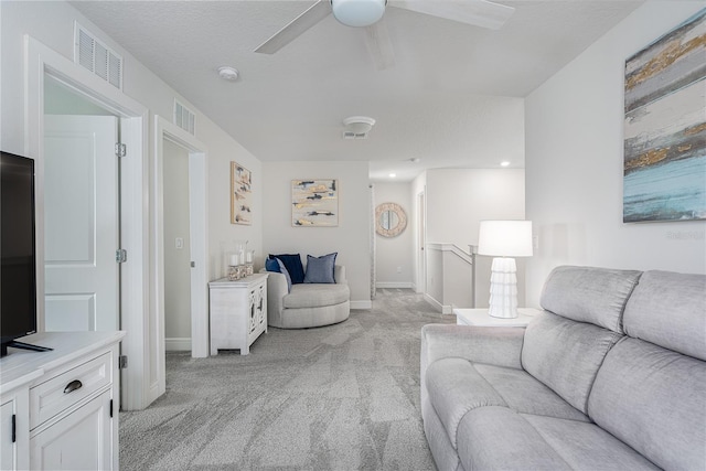 9144 Royal River Cir, Parrish, FL 34219 - living area with light carpet and a ceiling fan