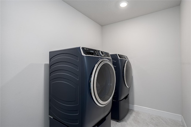 9144 Royal River Cir, Parrish, FL 34219 - washroom with washing machine and clothes dryer, light carpet, and recessed lighting