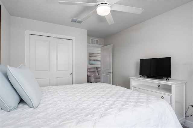 9144 Royal River Cir, Parrish, FL 34219 - bedroom with a closet and a ceiling fan