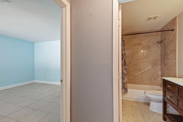 7298 Ulmerton Rd Unit 202, Largo, FL 33771 - full bathroom featuring a textured ceiling, tile patterned flooring, shower / tub combo with curtain, and vanity