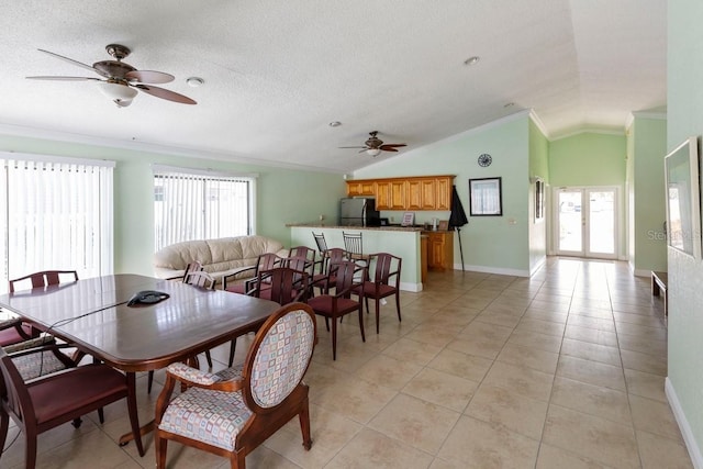 7298 Ulmerton Rd Unit 202, Largo, FL 33771 - dining space featuring ceiling fan, ornamental molding, lofted ceiling, and light tile patterned floors