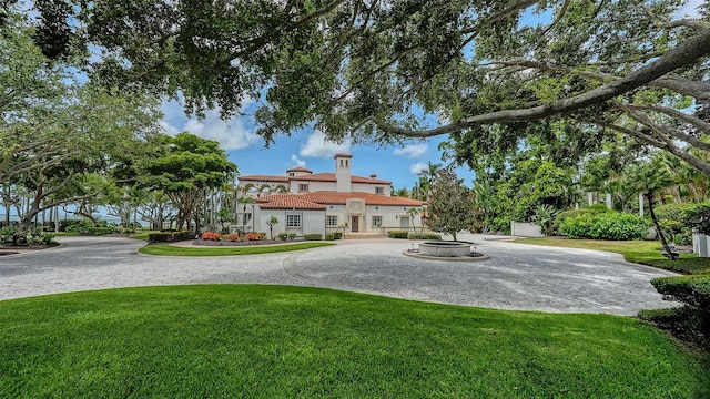 4423 Bay Shore Rd, Sarasota, FL 34234 - view of grassy yard with a fire pit