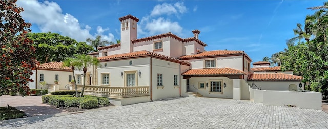 4423 Bay Shore Rd, Sarasota, FL 34234 - rear view of house featuring a tile roof and stucco siding