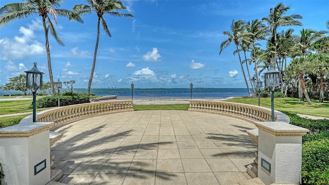 4423 Bay Shore Rd, Sarasota, FL 34234 - surrounding community with a water view and a lawn