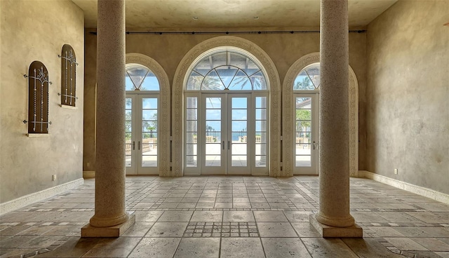 4423 Bay Shore Rd, Sarasota, FL 34234 - entryway featuring plenty of natural light and stone tile floors