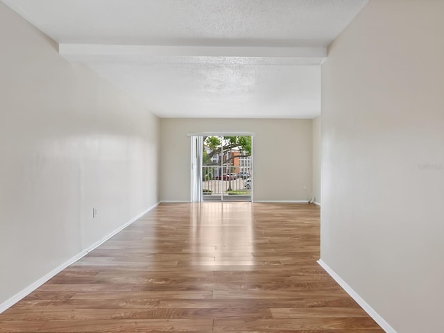 2423 Flamingo Blvd Unit K29, Bradenton, FL 34207 - spare room with wood finished floors and a textured ceiling