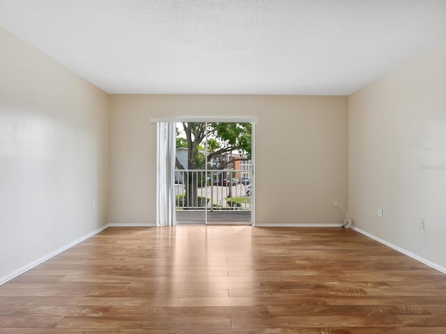 2423 Flamingo Blvd Unit K29, Bradenton, FL 34207 - unfurnished room with wood finished floors and baseboards