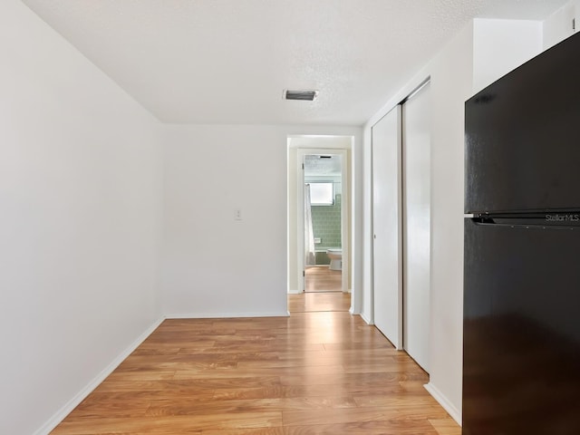 2423 Flamingo Blvd Unit K29, Bradenton, FL 34207 - corridor with light wood-type flooring and baseboards