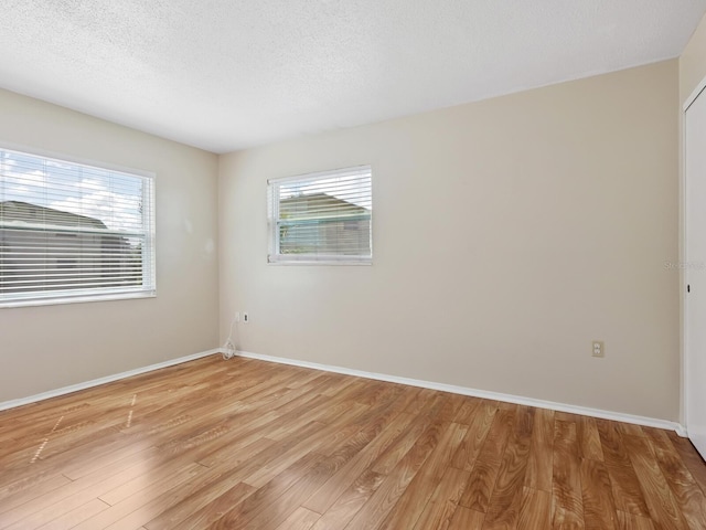 2423 Flamingo Blvd Unit K29, Bradenton, FL 34207 - empty room featuring light wood-type flooring and a textured ceiling