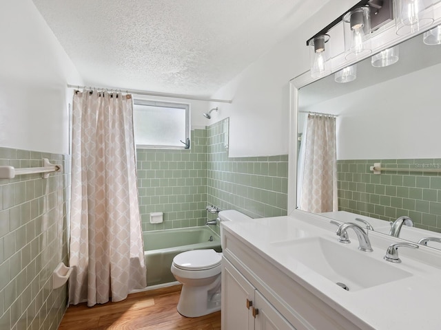 2423 Flamingo Blvd Unit K29, Bradenton, FL 34207 - full bath with tile walls, a textured ceiling, shower / bath combination with curtain, vanity, and a wainscoted wall