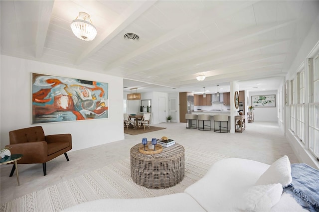 311 Island Cir, Sarasota, FL 34242 - living area with light colored carpet and beamed ceiling