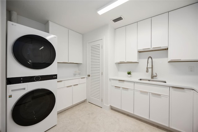 311 Island Cir, Sarasota, FL 34242 - washroom with estacked washer and dryer and cabinet space