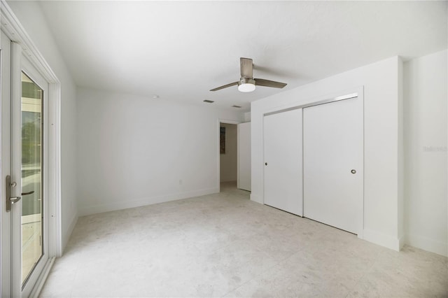 311 Island Cir, Sarasota, FL 34242 - unfurnished bedroom featuring a closet, a ceiling fan, and ensuite bathroom