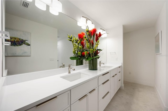 311 Island Cir, Sarasota, FL 34242 - bathroom featuring double vanity and baseboards