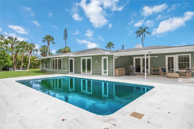 311 Island Cir, Sarasota, FL 34242 - outdoor pool featuring french doors, a patio area, and grilling area