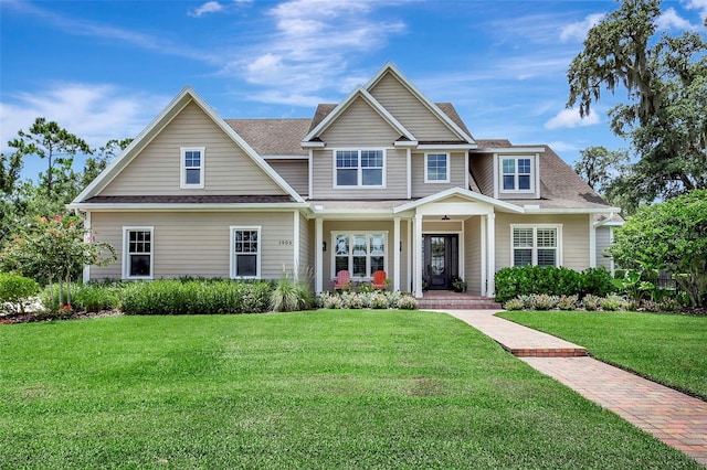 1906 143rd Ct E, Bradenton, FL 34212 - view of front of property featuring covered porch, a front lawn, and a shingled roof