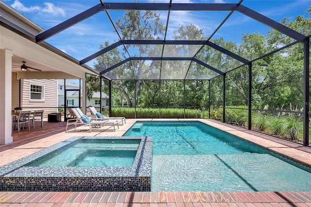 1906 143rd Ct E, Bradenton, FL 34212 - view of swimming pool with a patio area, a pool with connected hot tub, glass enclosure, and a ceiling fan