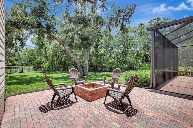 1906 143rd Ct E, Bradenton, FL 34212 - fenced backyard with a fire pit, a lanai, a patio area, and view of wooded area