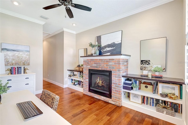 1906 143rd Ct E, Bradenton, FL 34212 - living room with ornamental molding, wood finished floors, a brick fireplace, recessed lighting, and a ceiling fan