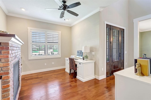 1906 143rd Ct E, Bradenton, FL 34212 - office space featuring light wood-type flooring, ornamental molding, a ceiling fan, and a fireplace
