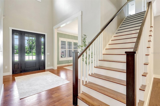 1906 143rd Ct E, Bradenton, FL 34212 - foyer entrance featuring stairs, a high ceiling, and wood finished floors