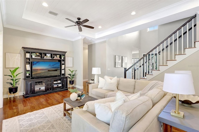1906 143rd Ct E, Bradenton, FL 34212 - living room featuring wood finished floors, a raised ceiling, stairs, a ceiling fan, and recessed lighting