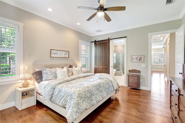 1906 143rd Ct E, Bradenton, FL 34212 - bedroom with ornamental molding, wood finished floors, multiple windows, recessed lighting, and a barn door